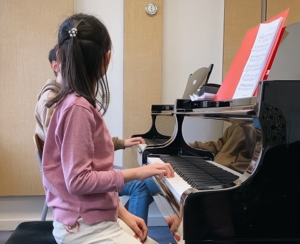 Child piano student during a lesson